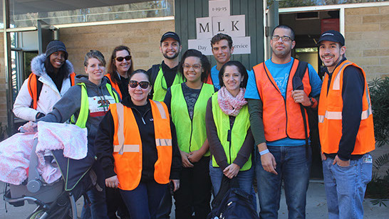 Get Involved group of volunteers in high-visibility vests are working together.