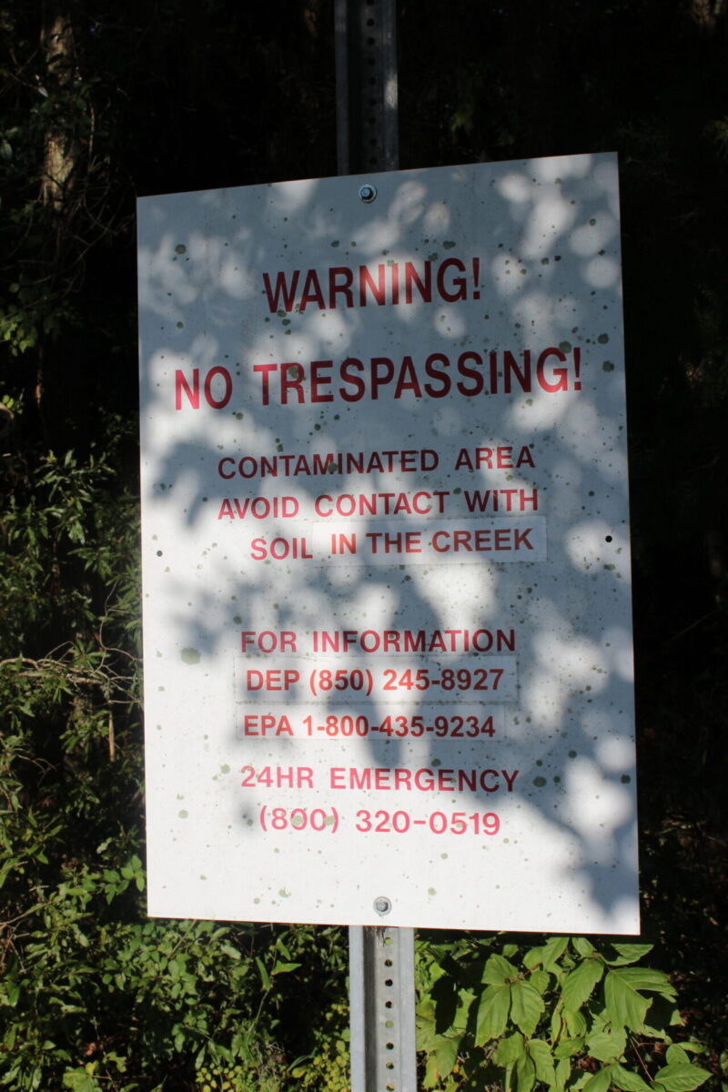 Springstead warning sign. Warning! No Trespassing! Contaminated with soil in the creek.